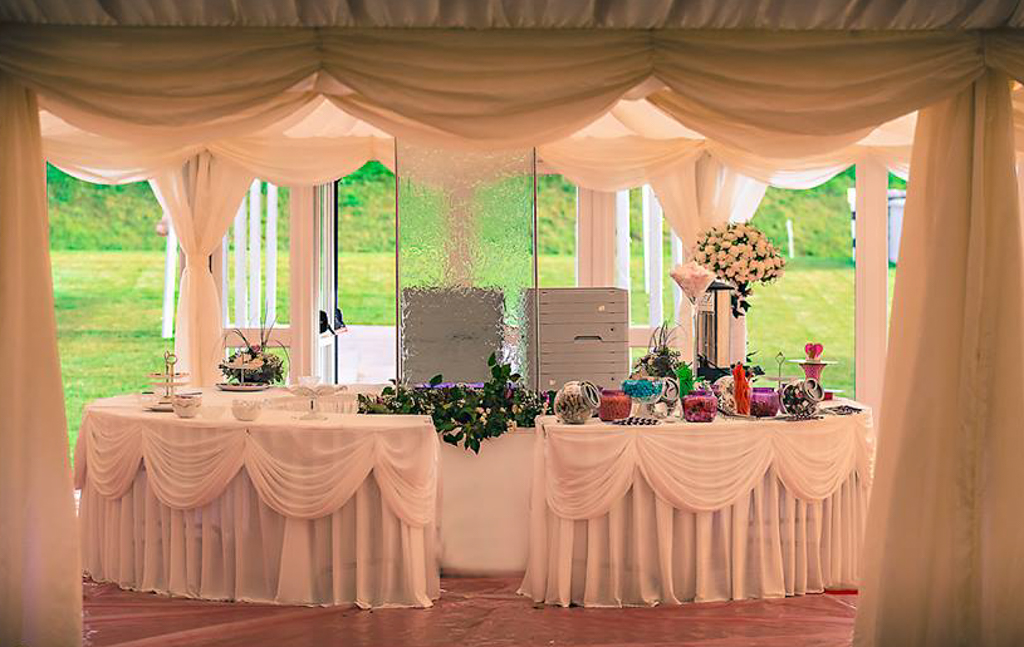 the interior of a marquee's entrance hall with a water feature centrepiece